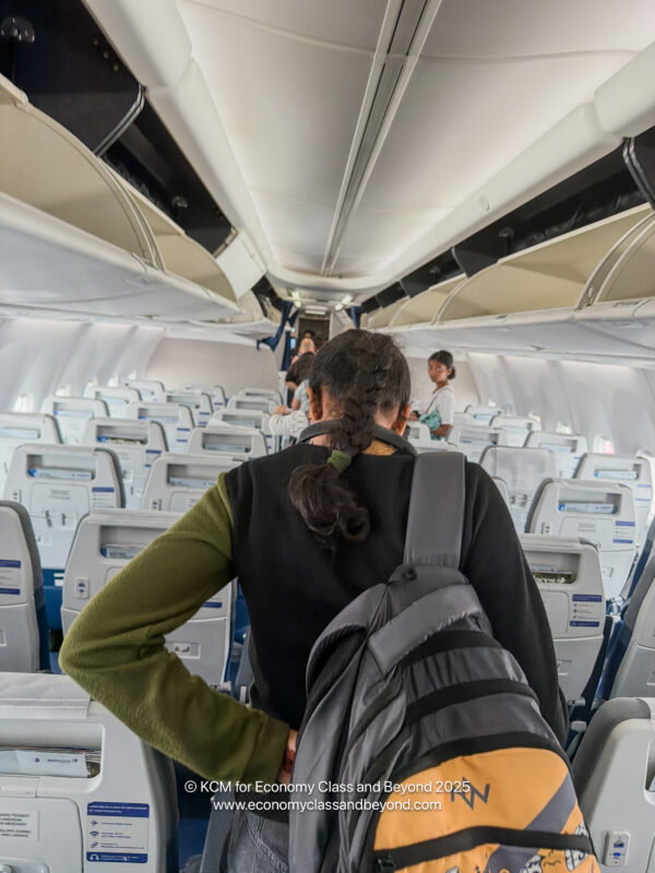 a person in a backpack on an airplane