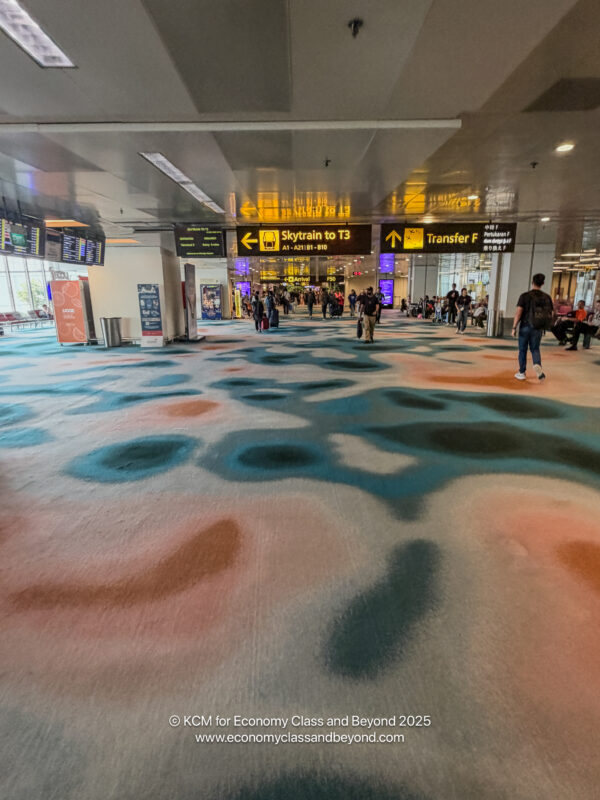 a group of people walking in an airport