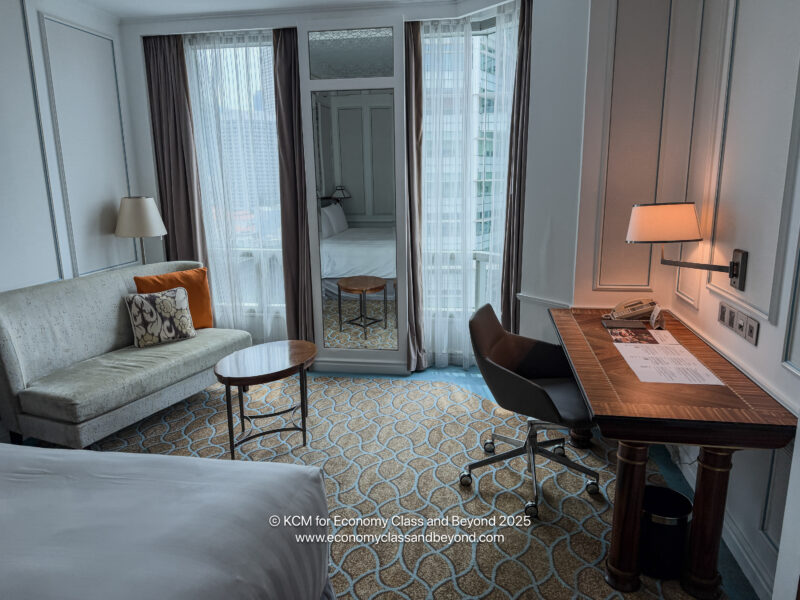 a room with a desk and a couch