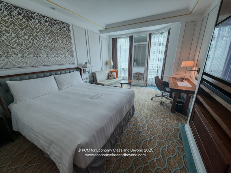 a room with a bed and a desk