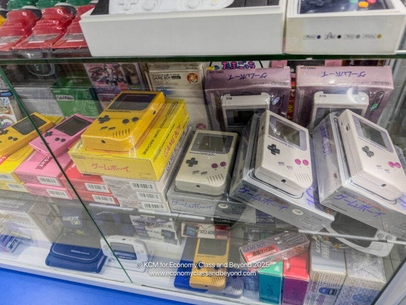 a glass case with video game consoles