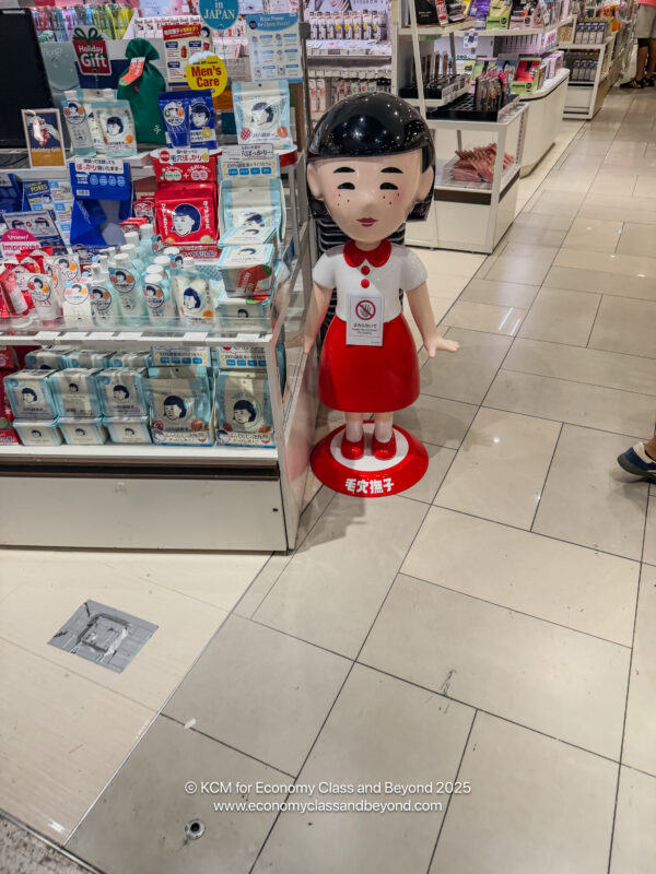 a statue of a girl in a store