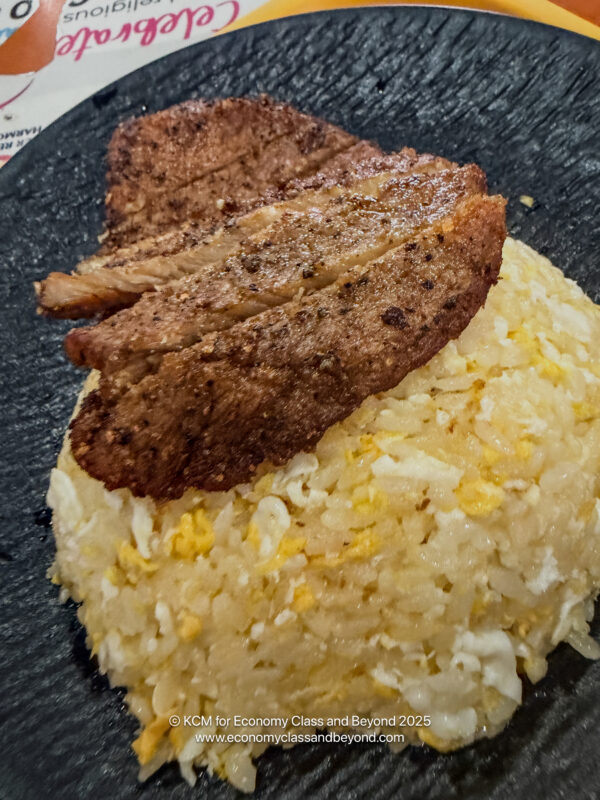 a plate of rice and meat