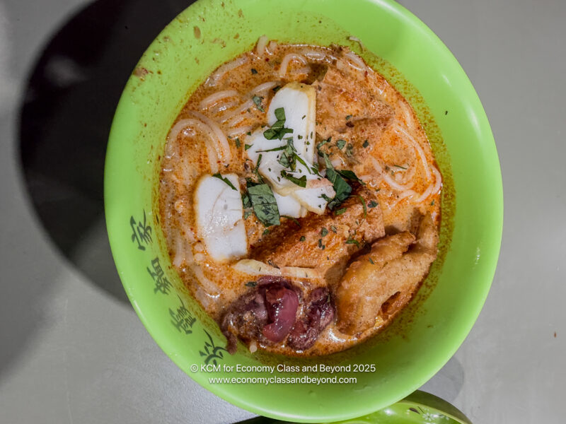 a bowl of soup with meat and vegetables