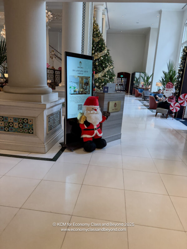 a stuffed santa claus in a lobby