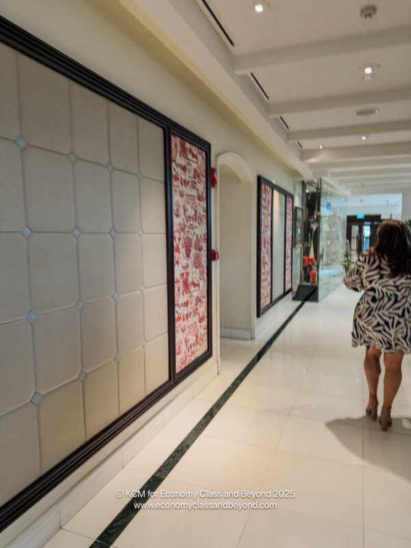 a woman walking in a hallway