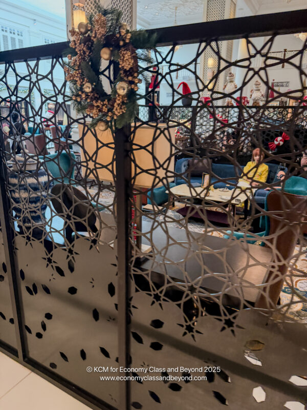 a room with a door and a wreath