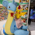 a large statue of a dragon and a cartoon character