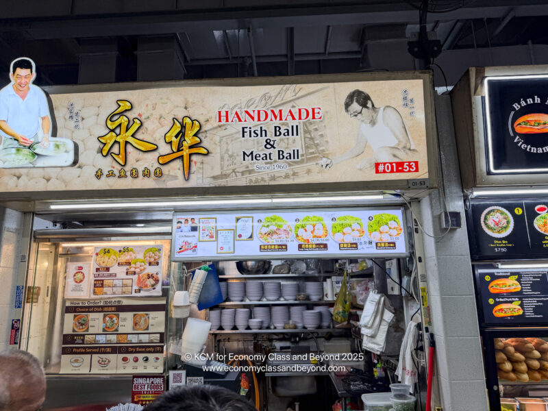 a sign for a fish and meat ball