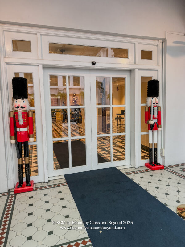 a door with glass doors and a pair of nutcrackers