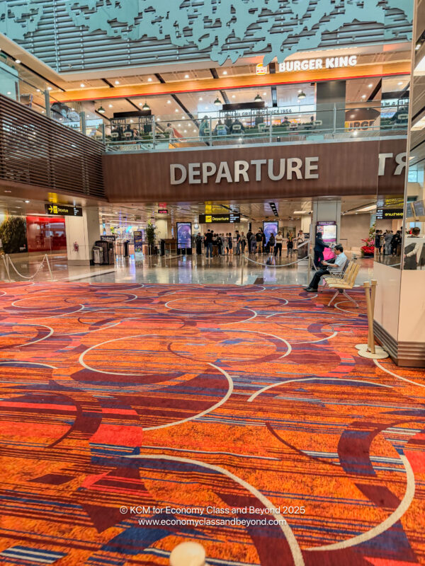 an airport with people walking around