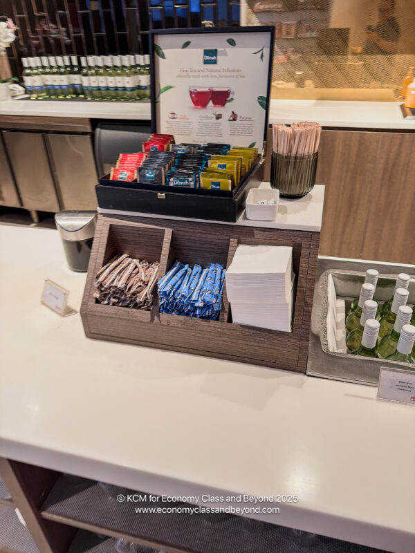 a counter with a variety of condiments and other condiments