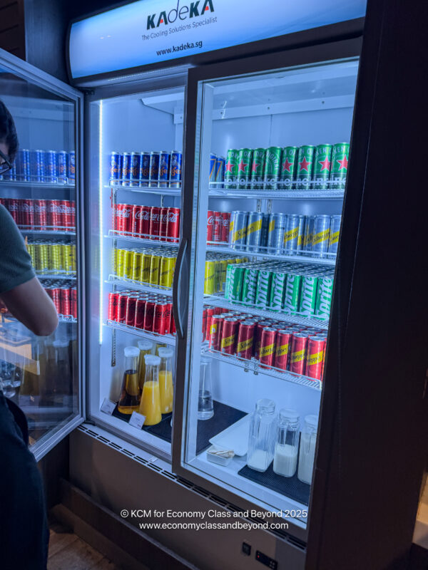a refrigerator with drinks and cans
