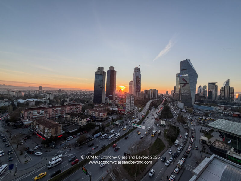 a city with many tall buildings and a road