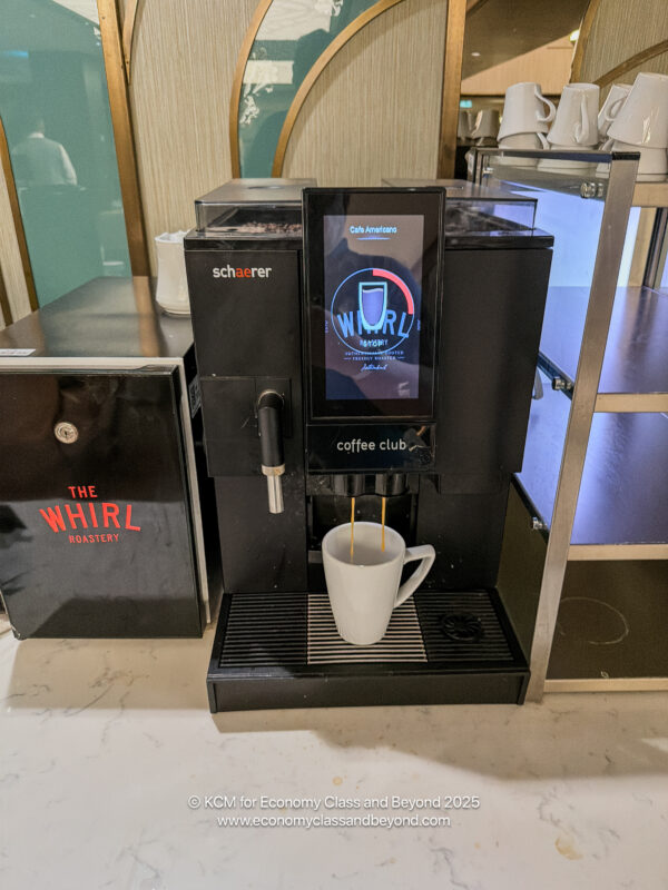 a coffee machine with a screen and a screen