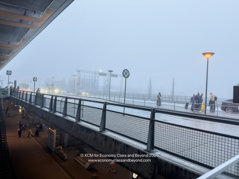 a group of people walking on a sidewalk