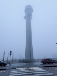 a tall tower in fog