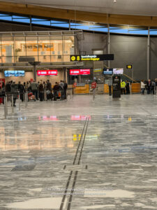 a group of people in a large airport