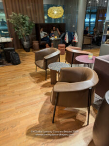 a group of people sitting around chairs