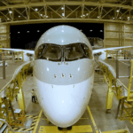 Qatar Airways 787 in a hanger being pushed back - Image, Qatar Airways