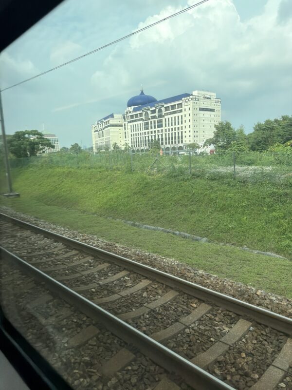 train tracks next to a building