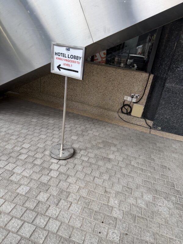 a sign on a sidewalk