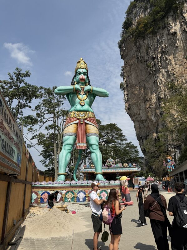 a statue of a man with a monkey head