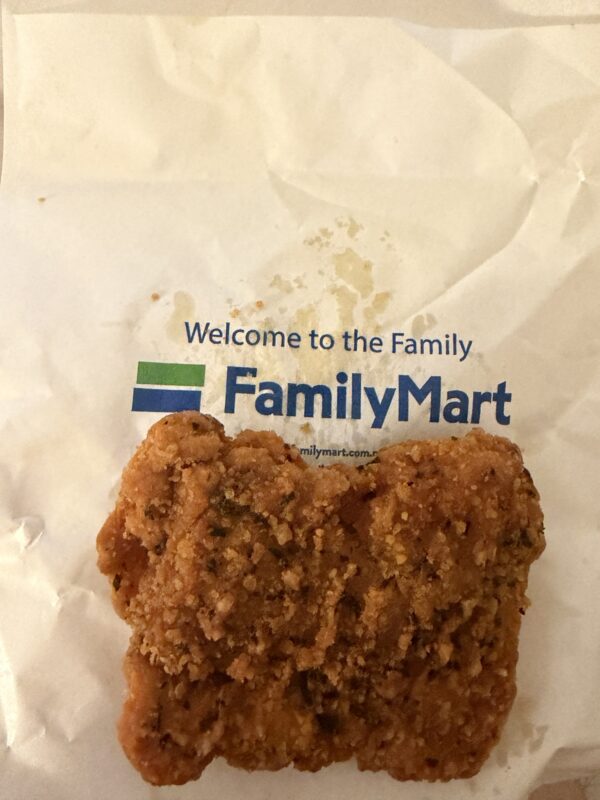 a piece of fried chicken on a white paper