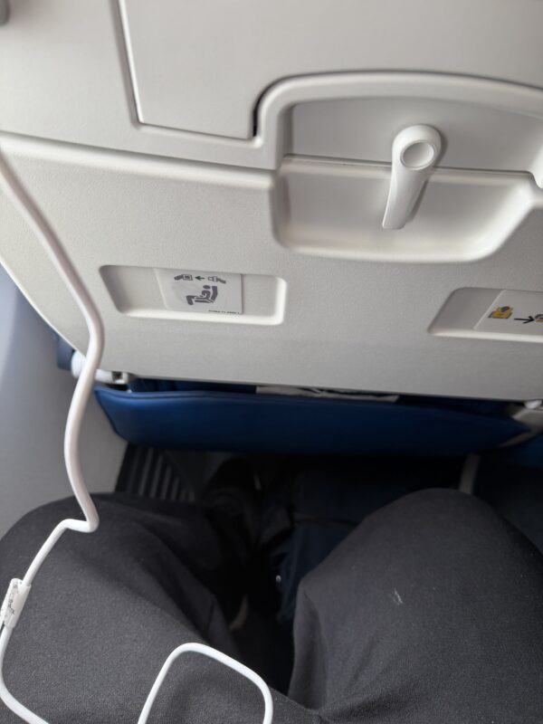 a seat with a white cord attached to it