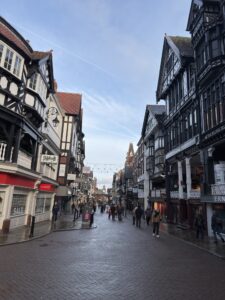a street with buildings and people walking on it