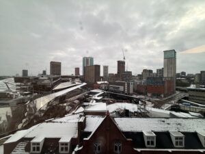 a city with snow on the roof