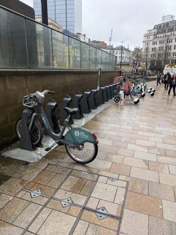 bicycles parked on a sidewalk