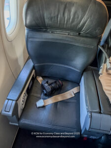 a camera on a seat in an airplane