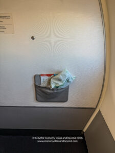 a pocket with a map and a piece of paper in it