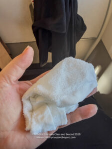 a hand holding a white towel