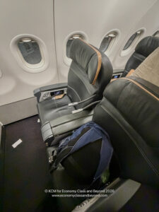 a black and blue backpack on a plane