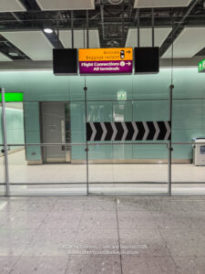 a glass wall with a sign and a sign on it