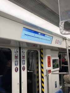 a subway with a screen on the door