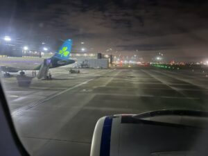 an airplane on the runway at night