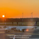 LOT Polish Airlines Embraer E195 pushing back at Sunseet - Image, Economy Class and Beyond