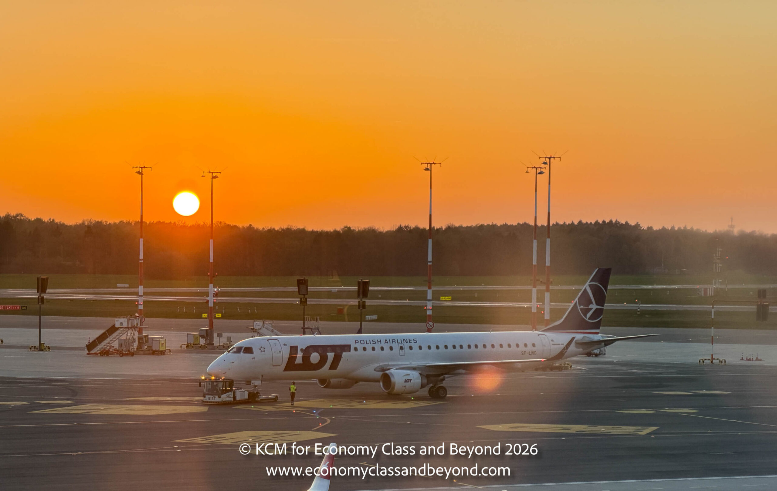 boardingarea.com - Kevincm - Airplane Art - LOT Polish Airlines Embraer E195 preparing to depart from Hamburg Airport - Economy Class & Beyond